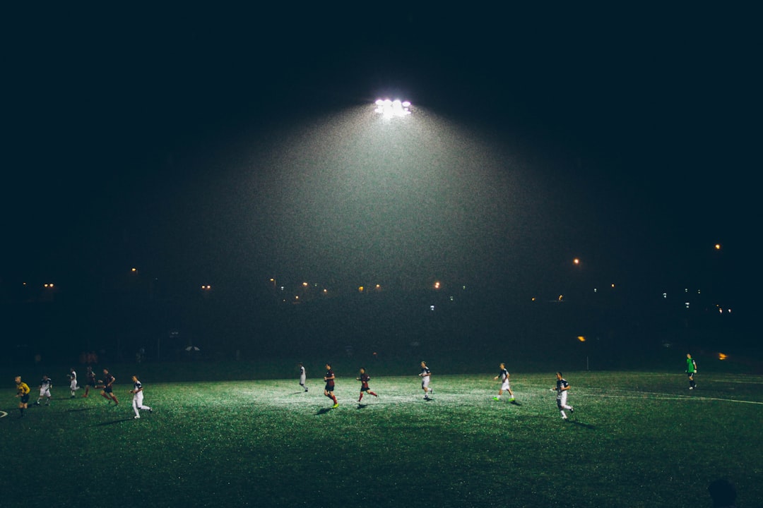 Floodlit football match at night